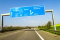 Blue freeway sign over the road in Germany on sunny day Royalty Free Stock Photo