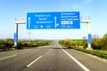 Blue freeway sign over the road in Germany on sunny day Royalty Free Stock Photo