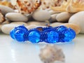 Blue friendship bracelet and sea stones