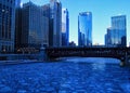 Blue and frigid winter morning in Chicago while el train passes over Chicago River Royalty Free Stock Photo