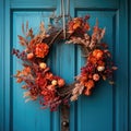 Blue front door with festive autumn wreath