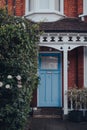 Blue front door a traditional Edwardian house in London, UK