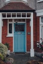 Blue front door a traditional Edwardian house in London, UK