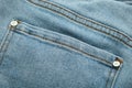 Blue front jeans pocket, jeans close-up. Macro