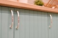 Blue front of kitchen cabinet with graceful handles. Part of modern kitchen interior close-up. Modern cuisine. Cabinet handle. Royalty Free Stock Photo