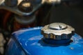 Blue fuel tank and silver cover of vintage Japanese motorcycle