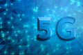 Big 5G letters on the flat surface with triangular pattern in blue colors. Royalty Free Stock Photo