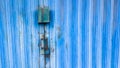 Blue garage door closed with diminished paint Royalty Free Stock Photo