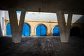 Blue garages under the bridge at the port of Malta`s capital. Valleta Royalty Free Stock Photo
