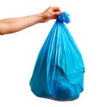 A blue garbage bag in a hand, isolated against a white or transparent background. Close-up of the blue garbage bag in a Royalty Free Stock Photo