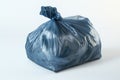 Blue garbage bag on white surface Royalty Free Stock Photo