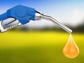 Blue gas pump nozzle with oil drop Royalty Free Stock Photo