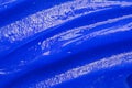 Blue gel texture. Cosmetic clear liquid cream smudge. Skin care product sample closeup. Toothpaste or wax