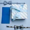 Blue gift box, blue gift envelope and two bow tie Royalty Free Stock Photo