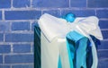 Blue gift box with a white bow on the background of a blue brick wall. View with a copy of the space Royalty Free Stock Photo