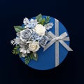 Blue Gift Box with White and Silver Flowers Royalty Free Stock Photo