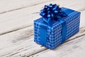 Blue gift box on wood. Royalty Free Stock Photo