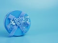 blue gift tin for baby boy isolated on blue background Royalty Free Stock Photo