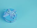 blue gift tin for baby boy isolated on blue background Royalty Free Stock Photo