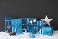 Blue Gifts With Christmas Decoration, Black Cement Wall, Snow