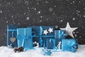 Blue Gifts With Christmas Decoration, Black Cement Wall, Snow, Snowflakes