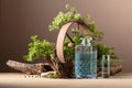 Blue gin in decanter with rusty iron wheel, old snags, and juniper branches Royalty Free Stock Photo