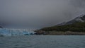 The blue glacier of Perito Moreno rises above the turquoise glacial lake Royalty Free Stock Photo