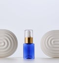 Blue glass bottle with pipette for cosmetics, oils and serum. Advertising and product promotion Royalty Free Stock Photo