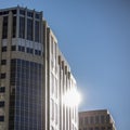 Blue glass building with reflection of the sun Royalty Free Stock Photo