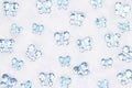 Blue glass butterflies on white fabric background