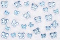 Blue glass butterflies on white fabric background
