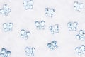 Blue glass butterflies on white fabric background