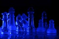 Blue Glass Chess Game board on dark background Royalty Free Stock Photo