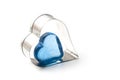 blue glass heart in a metallic heart on white background - Love concept Royalty Free Stock Photo