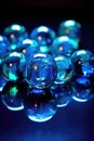 blue glass marbles reflecting light Royalty Free Stock Photo