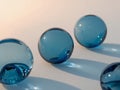 Blue Glass Marbles on White Surface with Shadows spheres Royalty Free Stock Photo