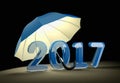 Blue glass number 2017 under umbrella. New year mataphor