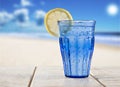 Blue glass with sparkling water and lemon Royalty Free Stock Photo