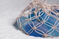 Blue glass stones in the fishnet Royalty Free Stock Photo