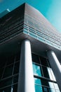 blue glass wall of skyscraper. Looking up a reflections on part of glass buildings Royalty Free Stock Photo