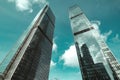 blue glass wall of skyscraper. Looking up of sky reflections on part of glass buildings Royalty Free Stock Photo