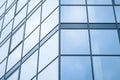 Blue glass wall of skyscraper, modern building, windows texture. Geometric abstract pattern. Architectural steel surface,