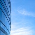 Blue glass windows of building against bright sky Royalty Free Stock Photo