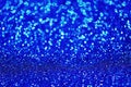 Blue glitter made by bokeh effect abstract background, copy space.