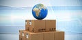 Composite image of blue globe on brown cardboard boxes Royalty Free Stock Photo