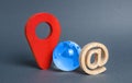 Blue globe planet earth, email symbol and red location indicator. The concept of a global communication system and the Internet