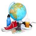 The blue globe, sneakers, thermos and headphones on white background. Royalty Free Stock Photo