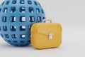 Blue Globe and Yellow Briefcase on White Background Royalty Free Stock Photo