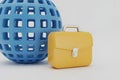 Blue Globe and Yellow Briefcase on White Background Royalty Free Stock Photo