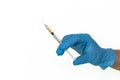 A blue-gloved hand holds a syringe, isolated Royalty Free Stock Photo